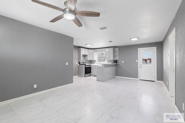 kitchen featuring white cabinetry, sink, ceiling fan, and stainless steel electric range