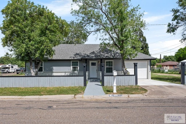 ranch-style home with a porch and a garage