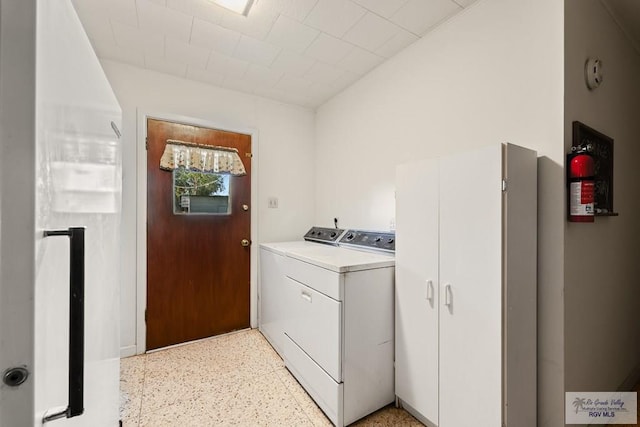 laundry room featuring washing machine and clothes dryer