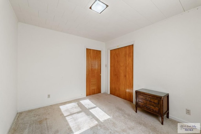 interior space featuring light colored carpet