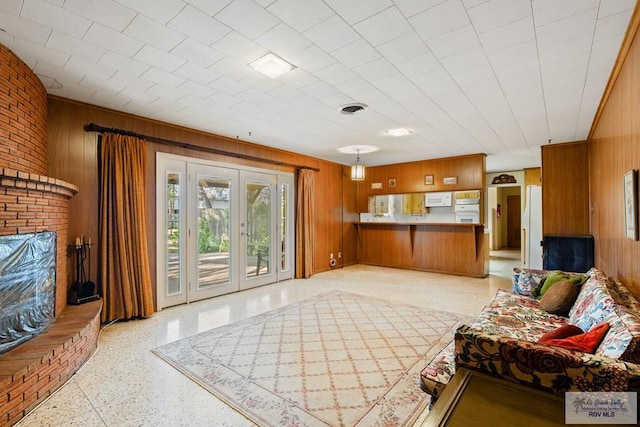 living room with wooden walls