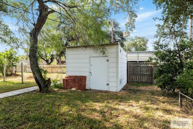 view of outdoor structure with a lawn