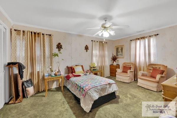 carpeted bedroom featuring ceiling fan and crown molding