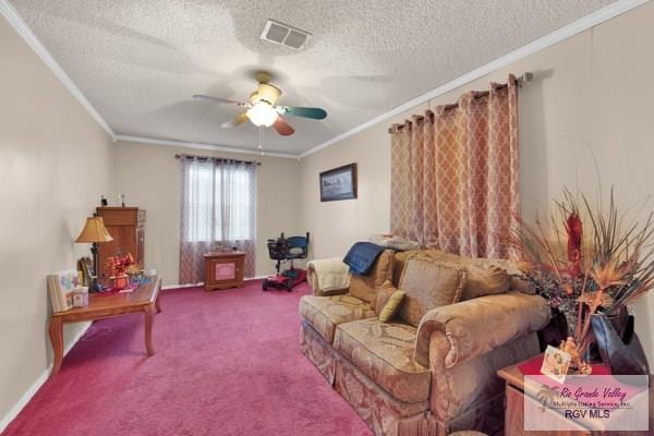 sitting room with carpet floors, a ceiling fan, visible vents, and crown molding