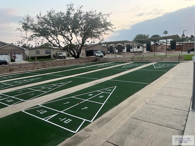 view of home's community featuring a residential view and shuffleboard