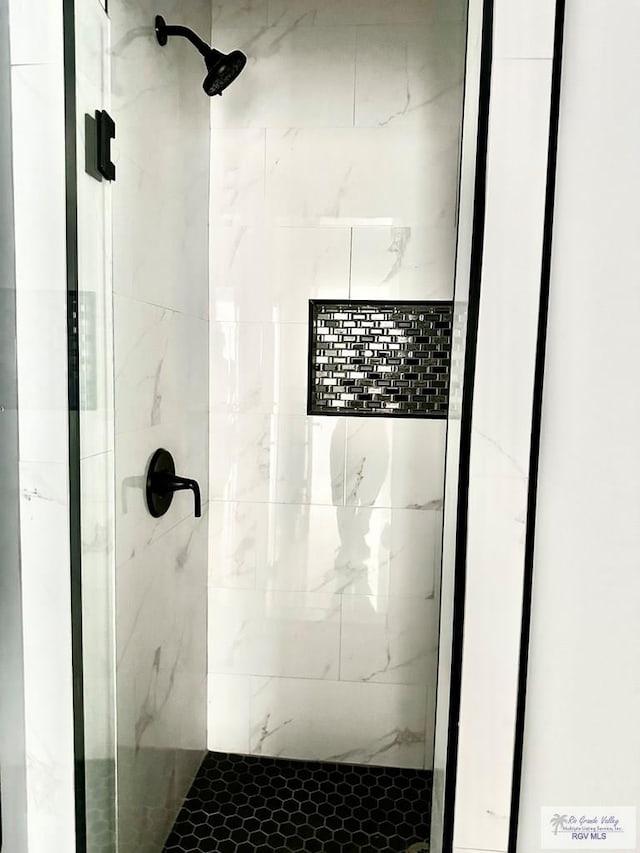 full bathroom with a shower stall