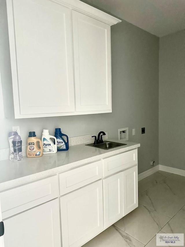 laundry room featuring washer hookup, marble finish floor, cabinet space, a sink, and electric dryer hookup