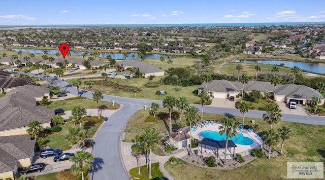 aerial view featuring a residential view and a water view