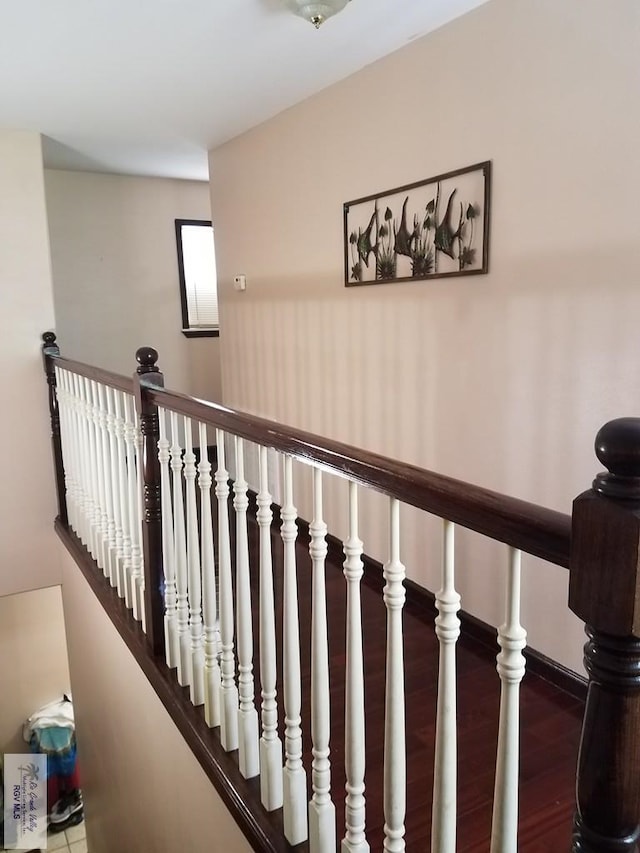 staircase with wood finished floors