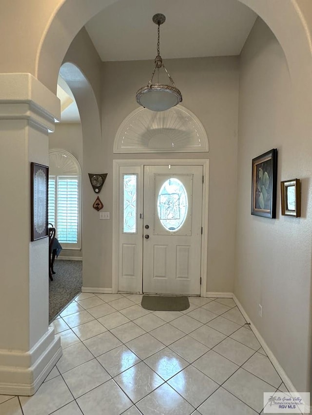 foyer featuring light tile patterned floors