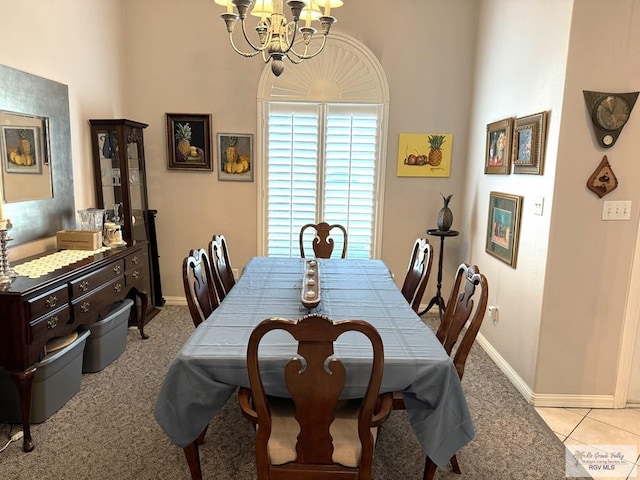 carpeted dining area with a notable chandelier and a towering ceiling