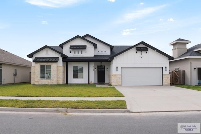 9484 S Queen Palm, Los Fresnos, TX 78566 - view of front facade with stone siding, board and batten siding, an attached garage, and concrete driveway