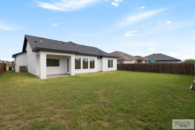 9484 S Queen Palm, Los Fresnos, TX 78566 - back of property featuring a fenced backyard, roof with shingles, and stucco siding