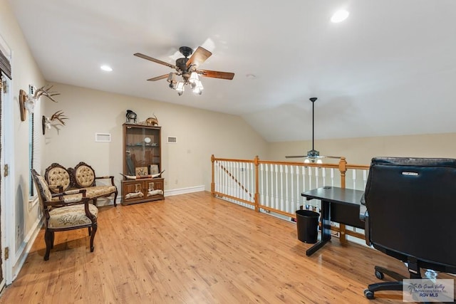 office featuring vaulted ceiling, ceiling fan, and light wood-type flooring