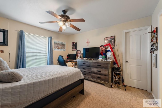 carpeted bedroom with ceiling fan