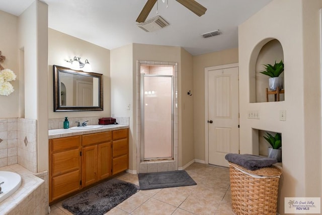 bathroom featuring vanity, separate shower and tub, and tile patterned flooring