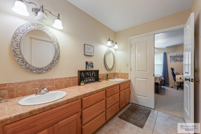 bathroom with tile patterned floors and vanity