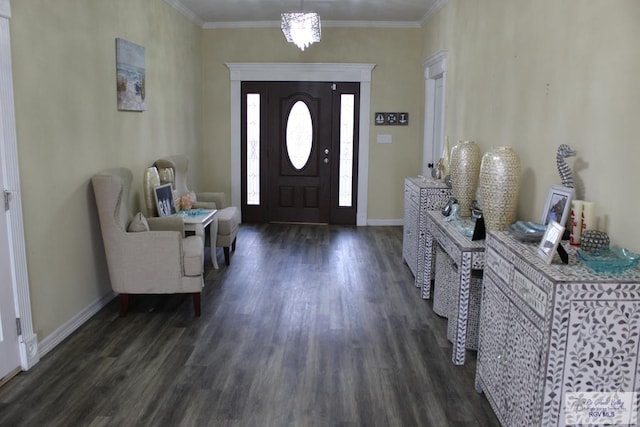 foyer entrance featuring dark hardwood / wood-style flooring, a chandelier, and ornamental molding