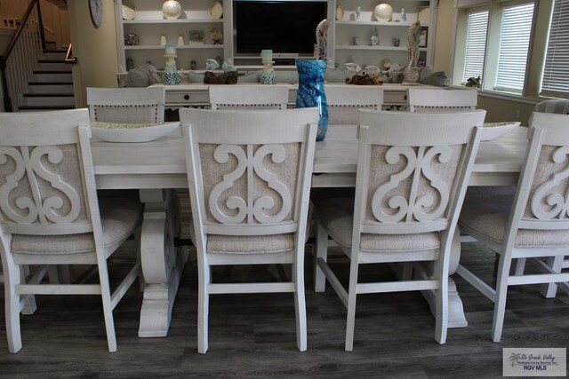 dining space featuring dark hardwood / wood-style floors