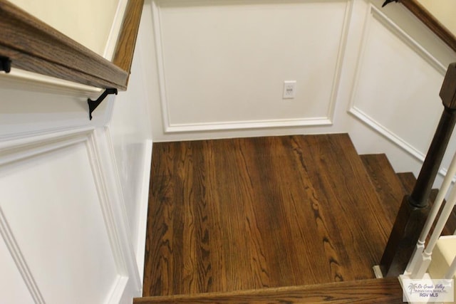 stairs with wood-type flooring