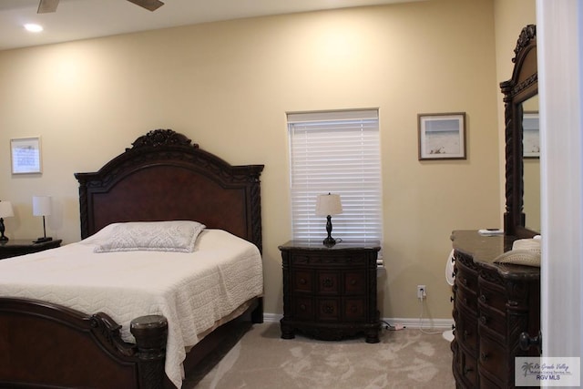 bedroom with light colored carpet and ceiling fan