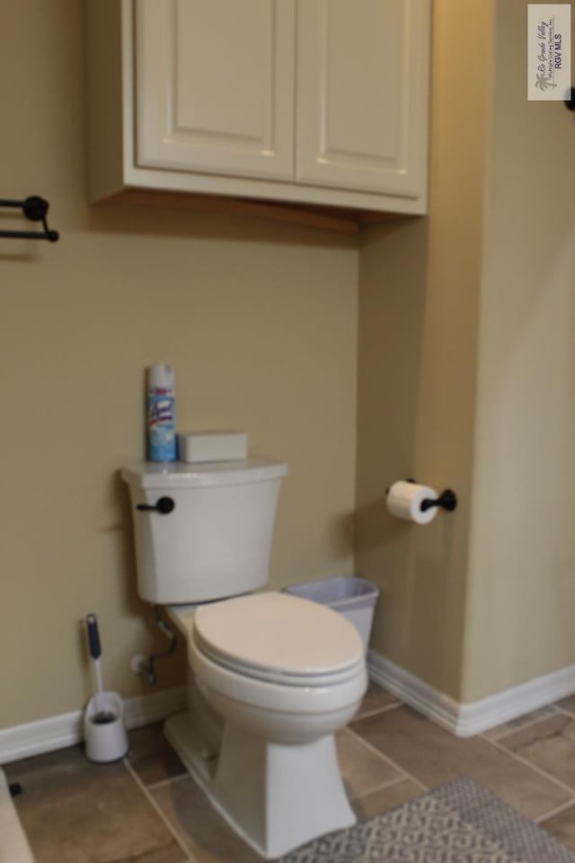 bathroom featuring tile patterned flooring and toilet