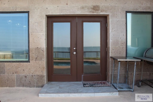 property entrance featuring french doors