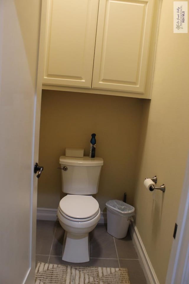 bathroom featuring tile patterned flooring and toilet