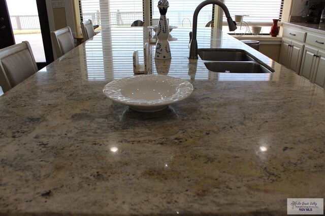 details featuring sink and stone counters