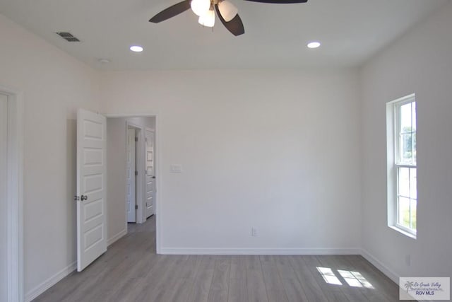 unfurnished room with ceiling fan and light hardwood / wood-style flooring