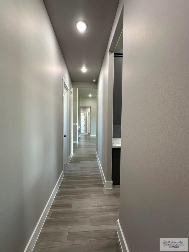 corridor featuring hardwood / wood-style floors