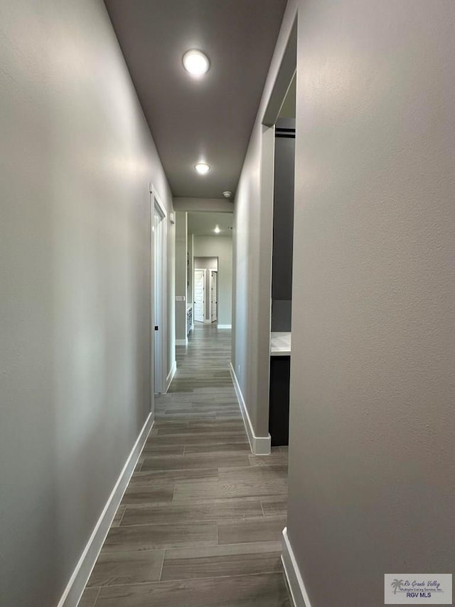 3406 Kelsey Ct, Harlingen, TX 78550 - hall featuring dark wood-style floors and recessed lighting