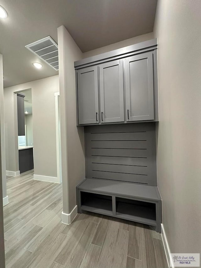 3406 Kelsey Ct, Harlingen, TX 78550 - mudroom with light wood-type flooring and recessed lighting