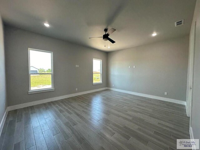 empty room featuring hardwood / wood-style flooring and ceiling fan