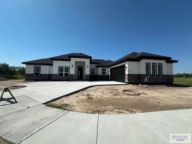 prairie-style house with a garage