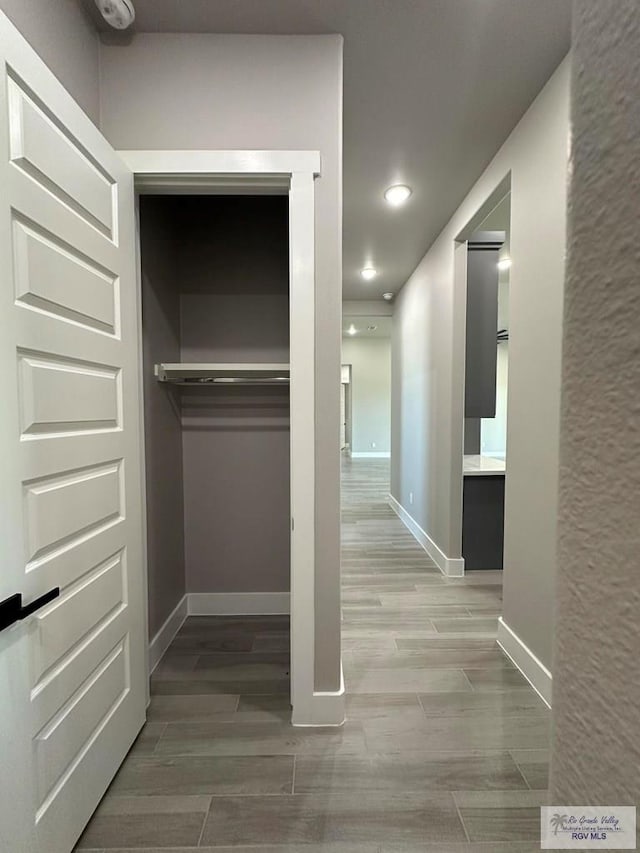 3406 Kelsey Ct, Harlingen, TX 78550 - hallway with recessed lighting and wood finished floors