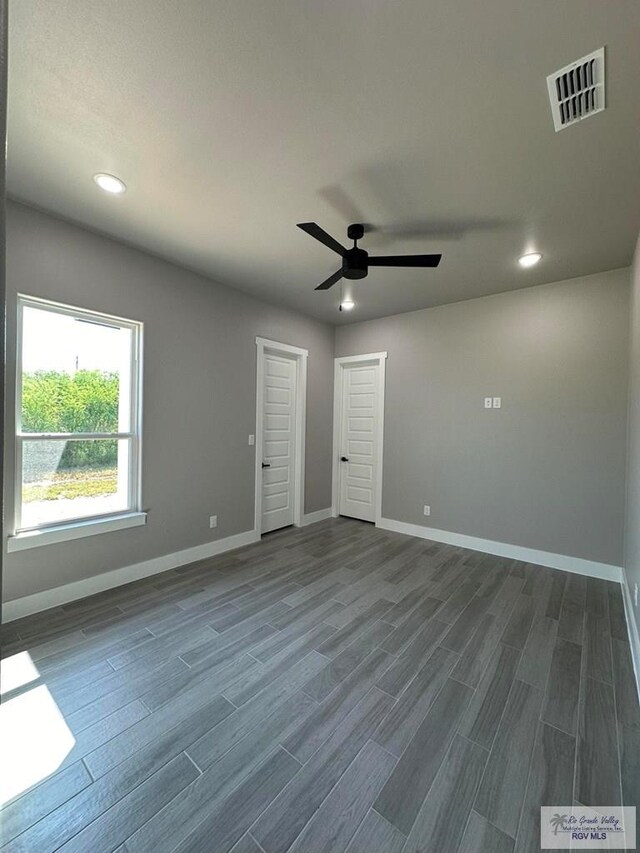 unfurnished room featuring ceiling fan and hardwood / wood-style floors