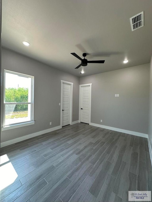3406 Kelsey Ct, Harlingen, TX 78550 - unfurnished room featuring dark wood-type flooring, a ceiling fan, and recessed lighting