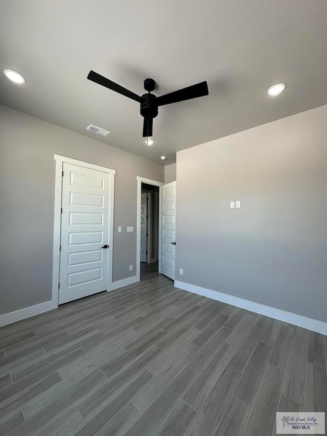 3406 Kelsey Ct, Harlingen, TX 78550 - unfurnished bedroom with dark wood finished floors, recessed lighting, and ceiling fan