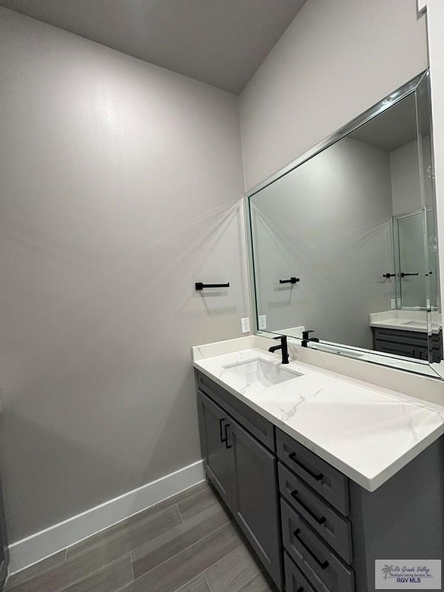 3406 Kelsey Ct, Harlingen, TX 78550 - full bath with vanity and wood finish floors