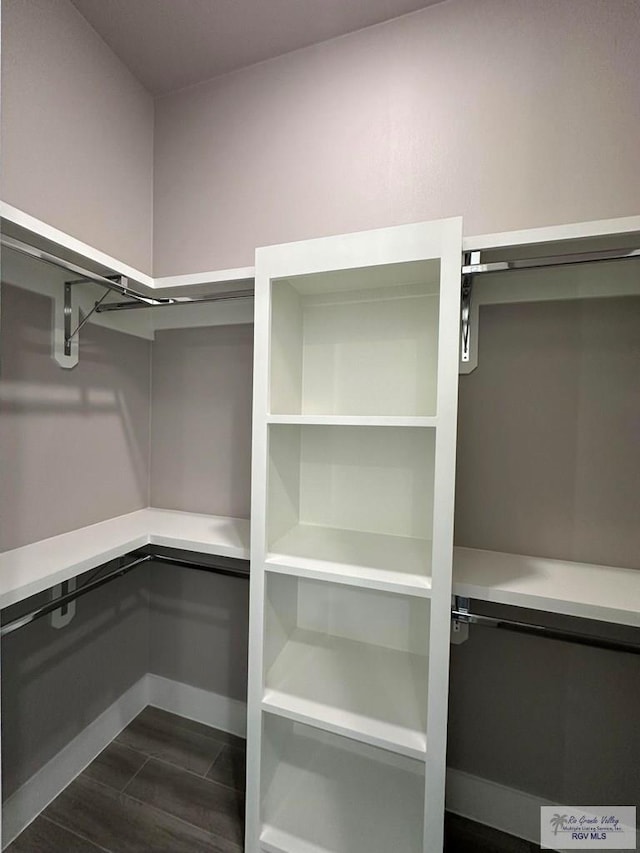 3406 Kelsey Ct, Harlingen, TX 78550 - spacious closet with dark wood finished floors