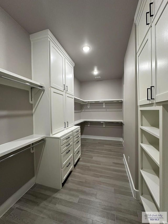 3406 Kelsey Ct, Harlingen, TX 78550 - spacious closet featuring dark wood finished floors