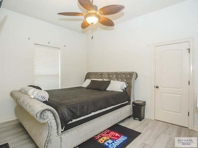 bedroom with ceiling fan and light hardwood / wood-style floors