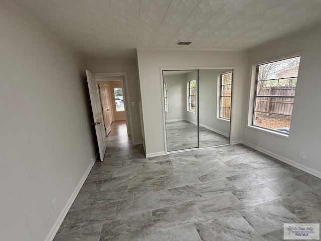 unfurnished bedroom featuring a closet