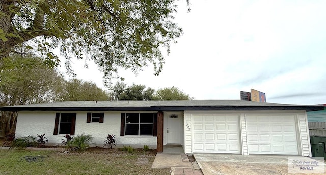 ranch-style home featuring a garage