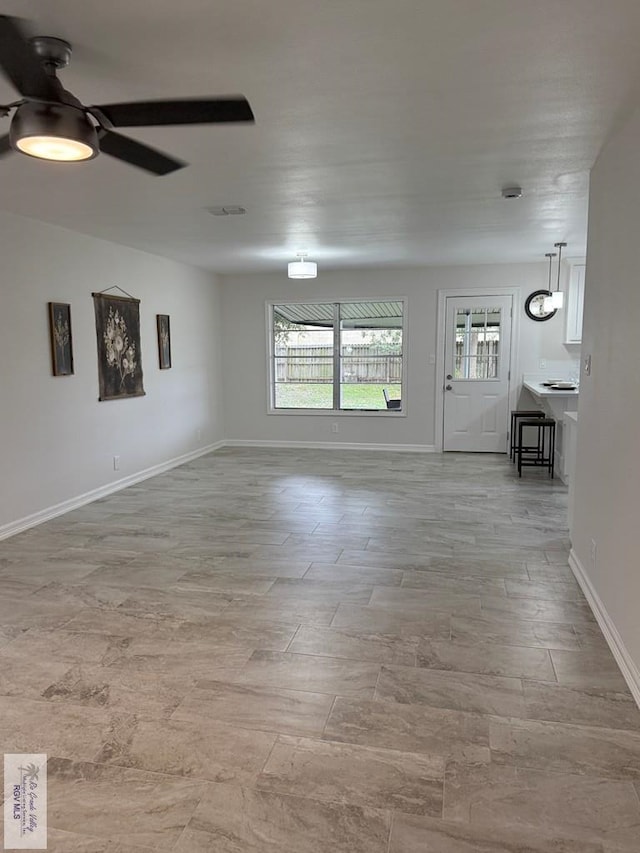 unfurnished room with ceiling fan