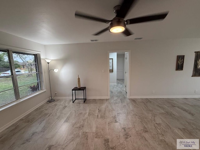 spare room with ceiling fan and light hardwood / wood-style flooring