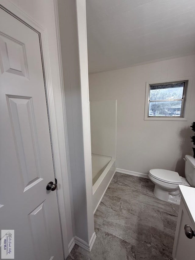 bathroom with vanity, toilet, and walk in shower