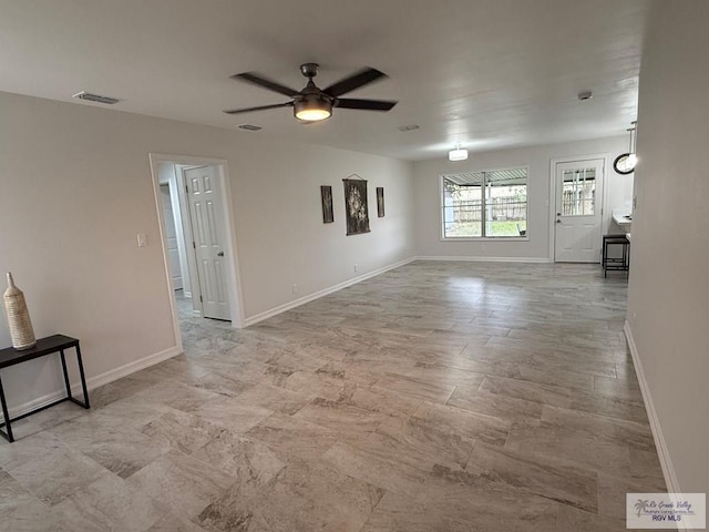 unfurnished living room with ceiling fan