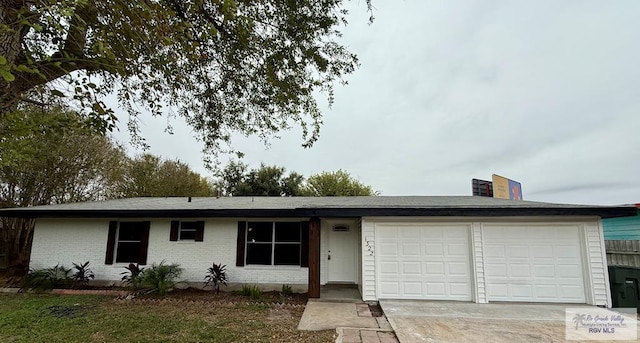 ranch-style house featuring a garage